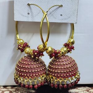 Maroon hoop earrings with a jhumka design and beaded accents.