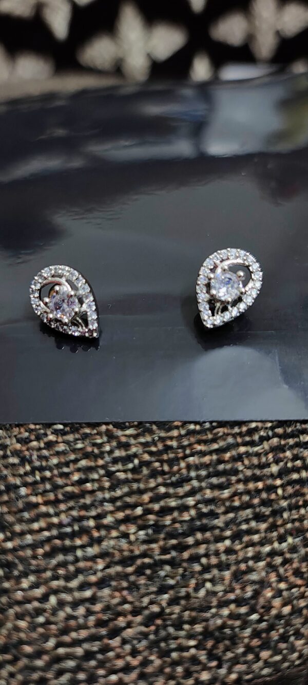 Teardrop earrings with crystal centers and pave crystal accents.