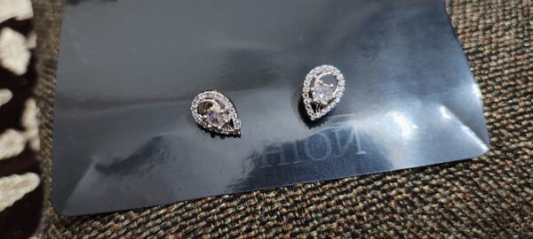 Teardrop earrings with crystal centers and pave crystal accents.