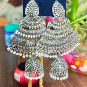 Oxidized silver jhumka earrings with pearl accents and intricate detailing.