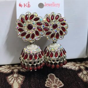 Red jhumka earrings with a floral design and sparkling rhinestones