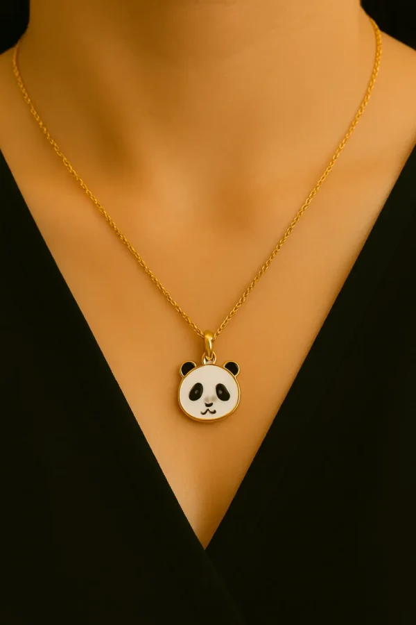 Woman wearing gold panda pendant necklace with black outfit