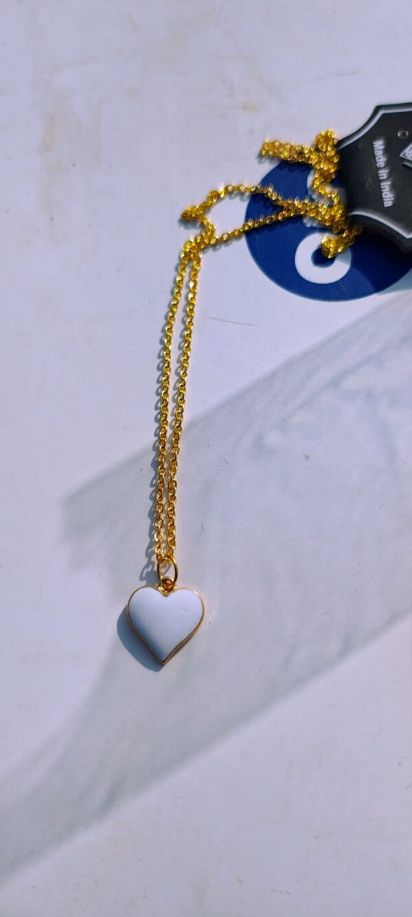 A white heart pendant necklace with a gold-toned chain