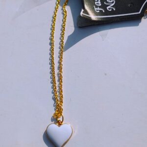 A white heart pendant necklace with a gold-toned chain