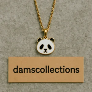 Cute gold panda pendant necklace placed on Dams Collections tag