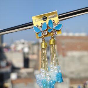 Blue butterfly earrings with tassels and pearl accents.