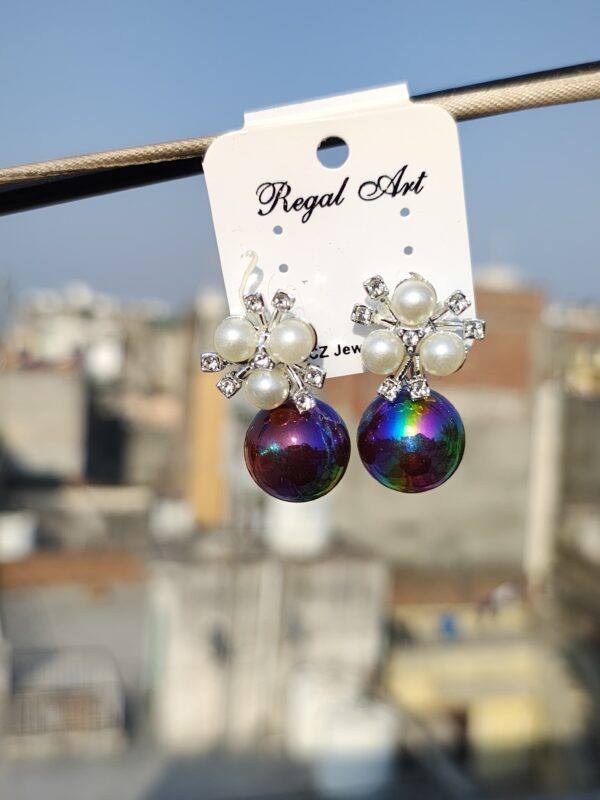 Stud earrings with an iridescent pearl and crystal accents.