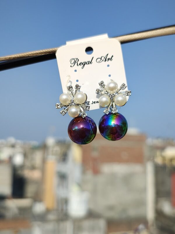 Stud earrings with an iridescent pearl and crystal accents.