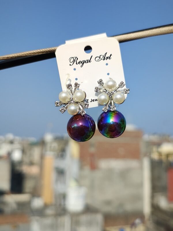 Stud earrings with an iridescent pearl and crystal accents.