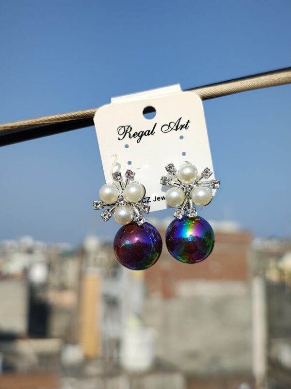 Stud earrings with an iridescent pearl and crystal accents.