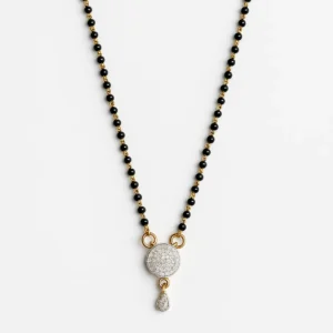 Artificial diamond mangalsutra with black and gold beaded chain and circular pendant design.